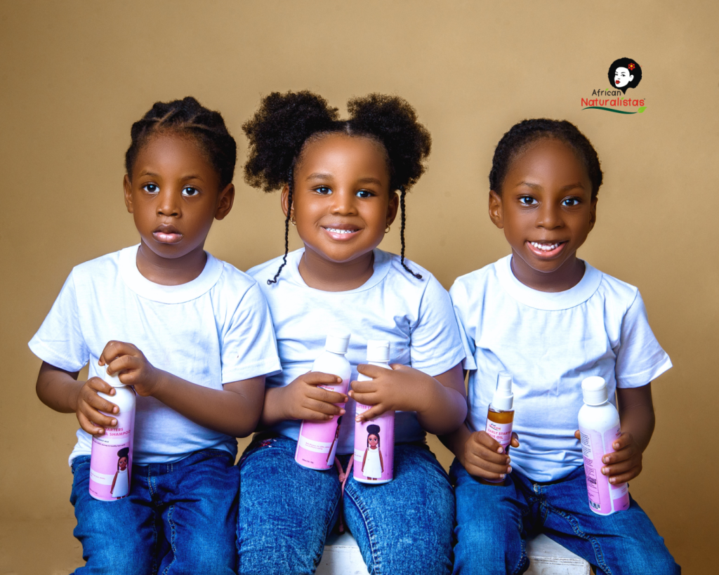 3 Children Holding The African Naturalistas Early Starters set For Children's Hair Growth