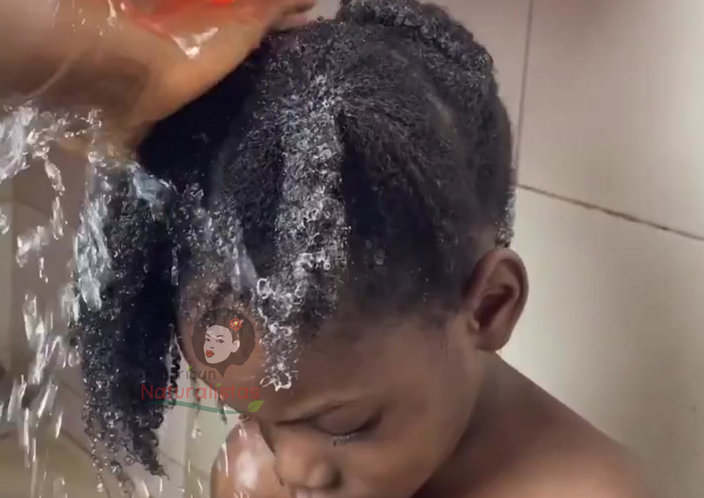 Image of a child having his hair washed using the African Naturalistas products