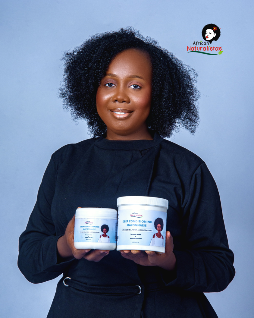 African Naturalistas model holding African Naturalistas Deep Conditioning Mayonnaise 