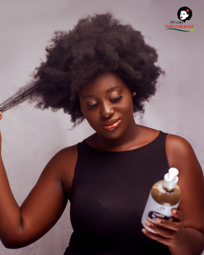 African Naturalsitas model holding a liquid black soap